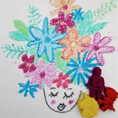 Lady’s head with flower hair drawn with brick man, unicorn and dinosaur