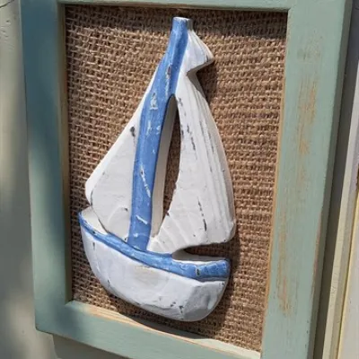 Handcarved boat on a hessian sage frame 2