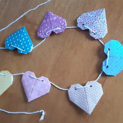 Origami heart garland on table