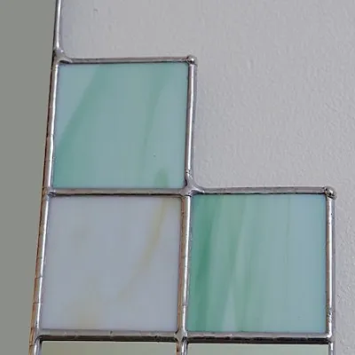 Art Deco wall mirror in green and cream stained glass