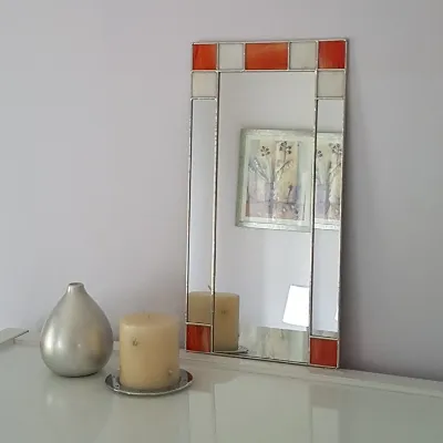 Small Art Deco orange wall mirror