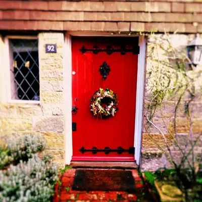 The Jingle Of Bells Christmas Wreath Kit on a Red Door