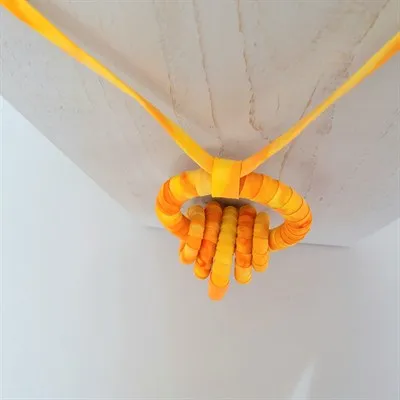 Yellow fabric pendant necklace from above