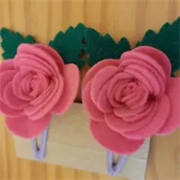 2 Felt Rose hair clips hair accessories. 3