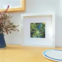Framed woven paper art 'Spring Green' in room setting