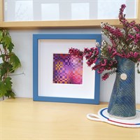 Framed woven paper artwork 'Beyond' in room setting