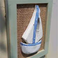 Handcarved boat on a hessian sage frame 3