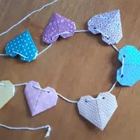 Origami heart garland on table gallery shot 6