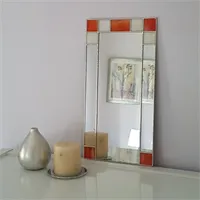 Small Art Deco orange wall mirror