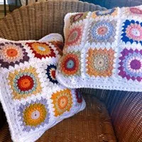 Sunburst Square Cushion 2 - it't the one on the right in this photo. gallery shot 1