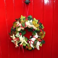 The Jingle Of Bells Christmas Wreath Kit Focus on a Red Door