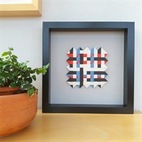 Woven paper artwork 'Crossing the Line' in room setting